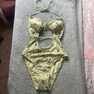 Aeropostale one piece tie suit. Pastel green floral print. Never been worn.